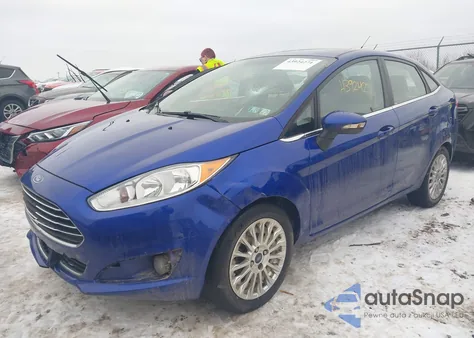 2014 Ford Fiesta Titanium z USA, uszkodzony, nr VIN 3FADP4CJ3EM195594